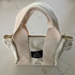 BDG mini canvas tote. Excellent condition. White and off white color tones.